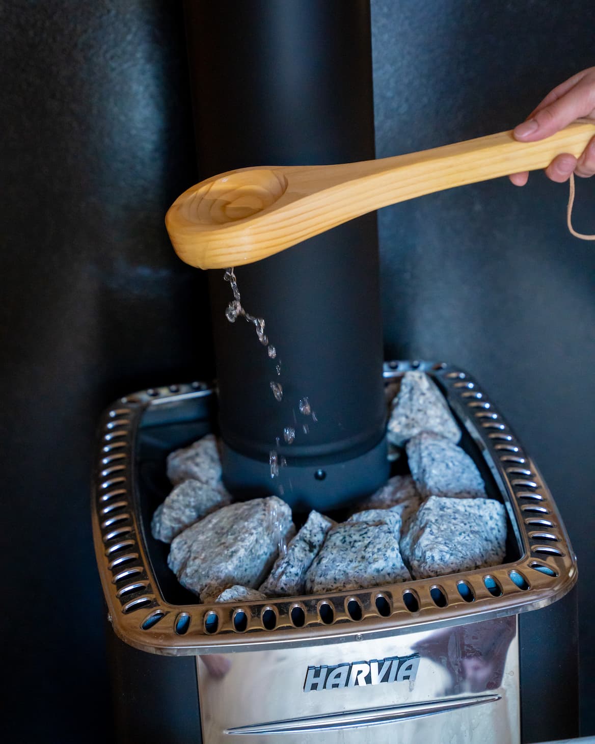 Sauna exterior with wood stove and bench seating